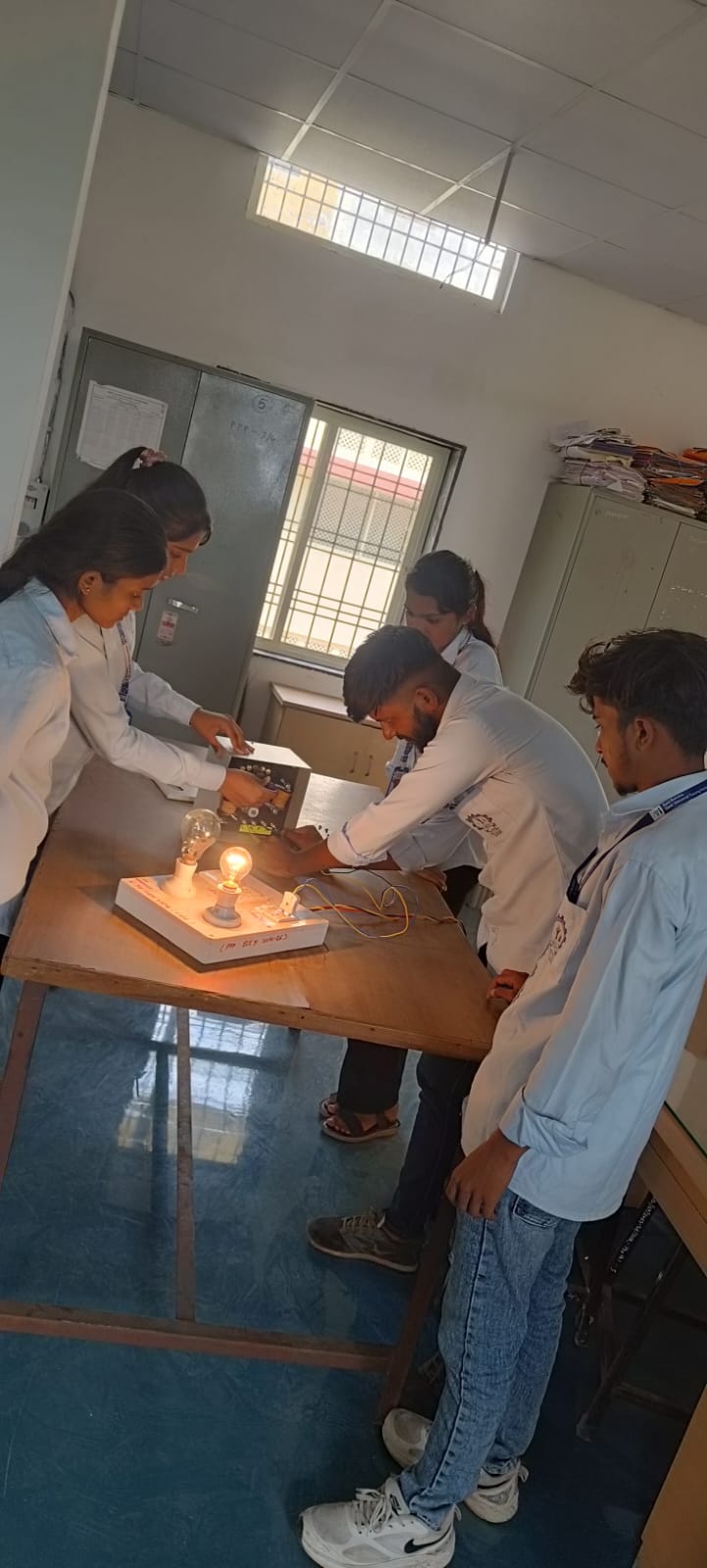 Electrician trainees observing a practical demonstration